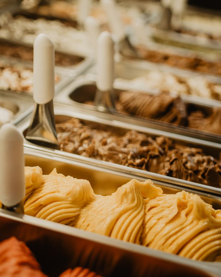 Pans of gelato in a display case
